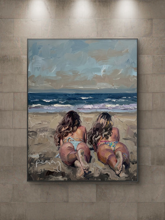 The one with her twin sister on the beach