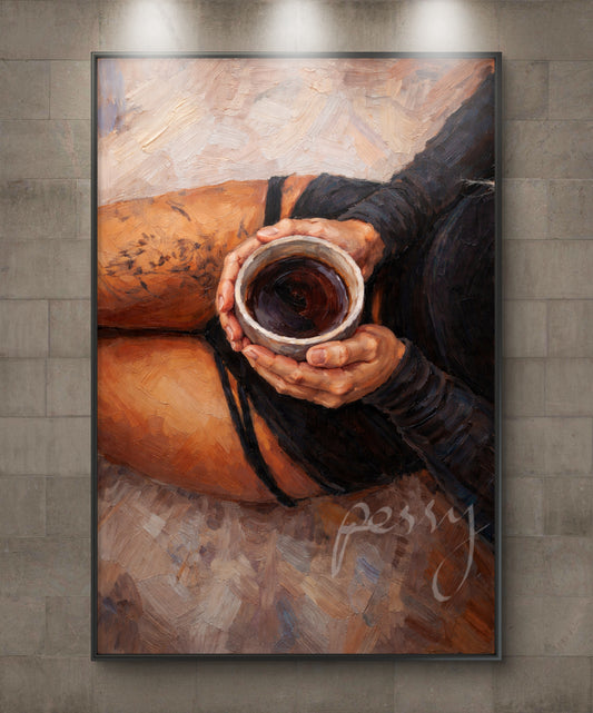 The one holding the coffee mug on her lap
